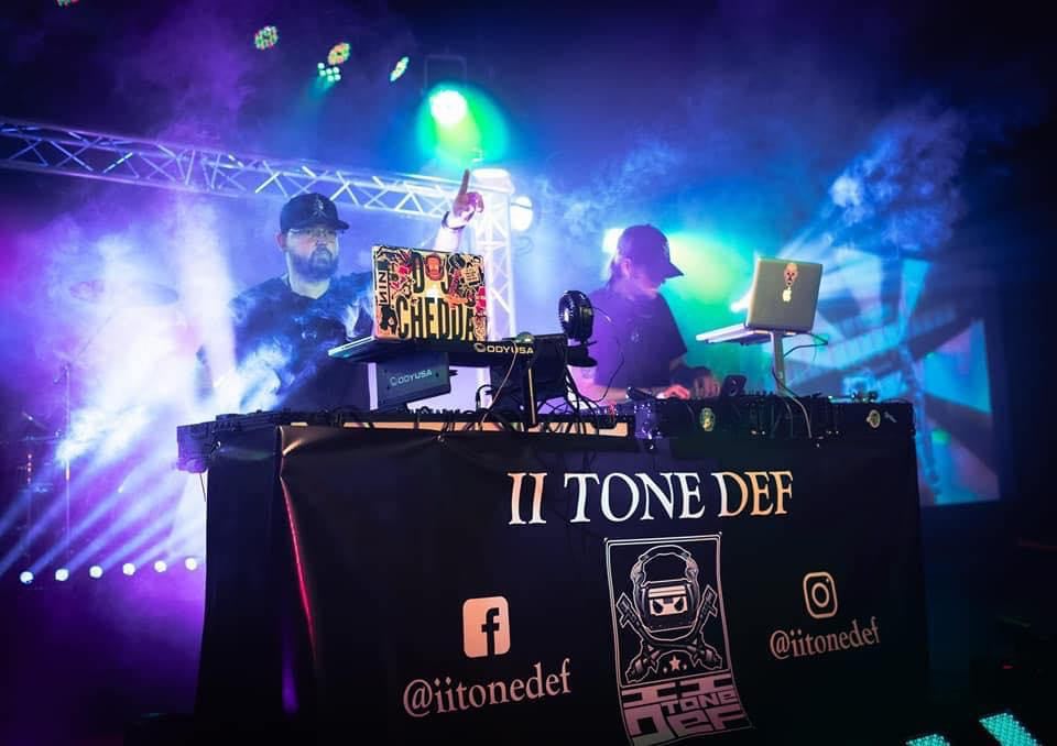 II Tone def, an Atlanta DJ group, playing in front of a crowd